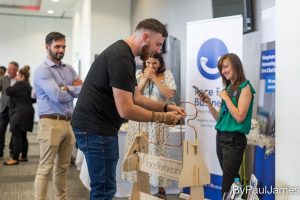 Manchester-Biz-Fair-2022-visitors-play-game-at-Face-for-Business-exhibition-space